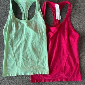 Two Fabletics Feather Tech Racerback Tank Tops